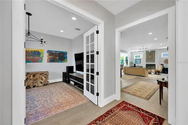 a view of a dining room with furniture and wooden floor