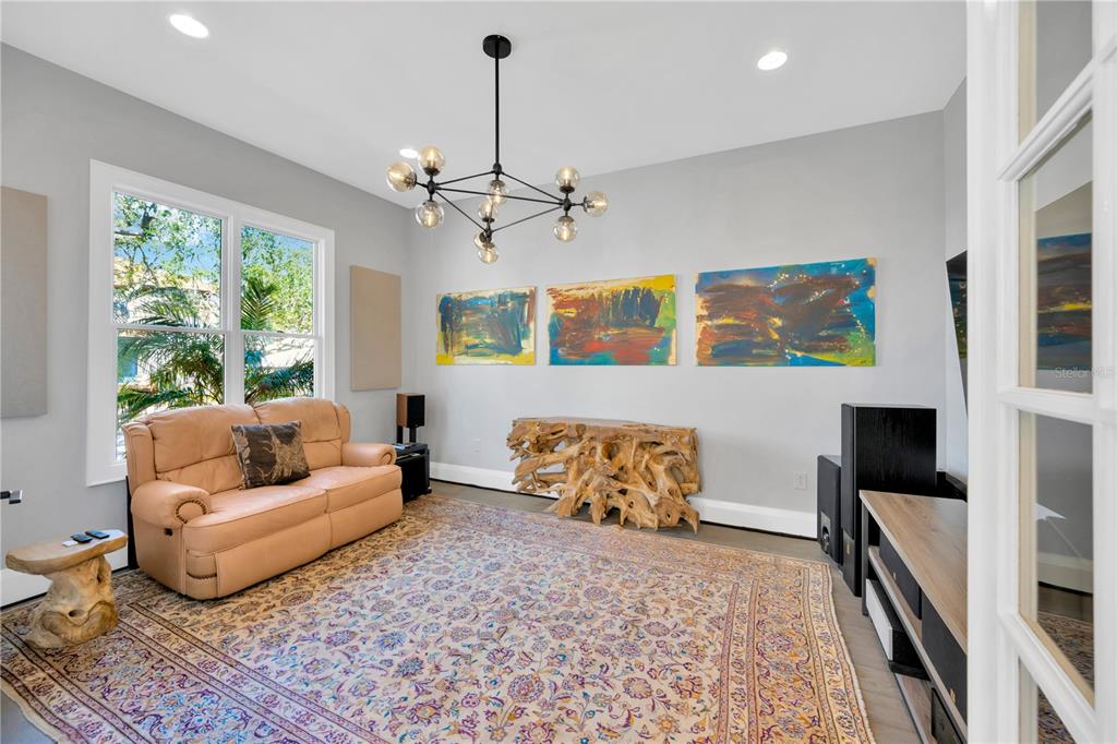 2802 Northpointe Lane Tampa, FL 33611 - Photo 36 of 55 a living room with furniture and a flat screen tv