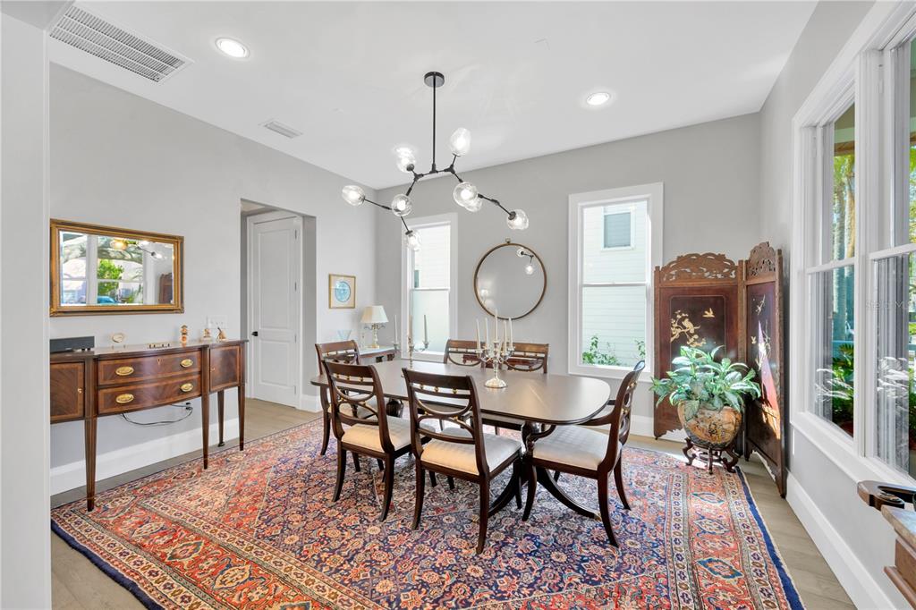 2802 Northpointe Lane Tampa, FL 33611 - Photo 39 of 55 a view of a dining room with furniture and wooden floor
