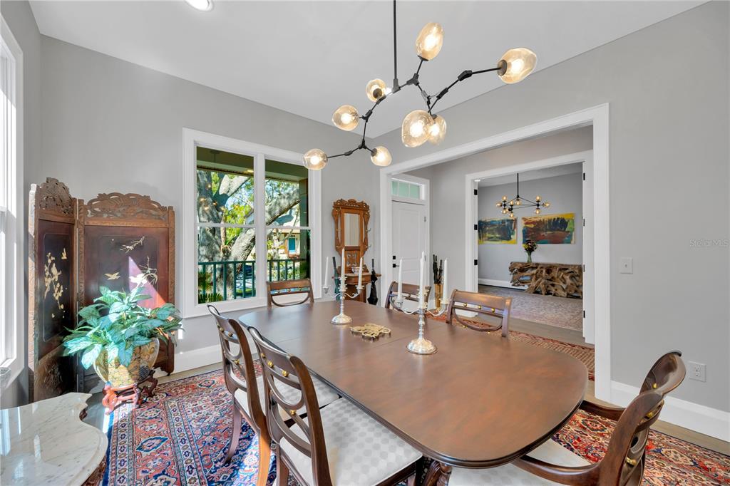 2802 Northpointe Lane Tampa, FL 33611 - Photo 40 of 55 a view of a dining room with furniture window and wooden floor