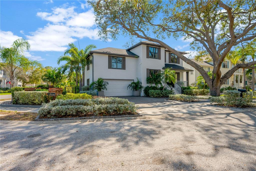 2802 Northpointe Lane Tampa, FL 33611 - Photo 4 of 55 a front view of a house with a garden