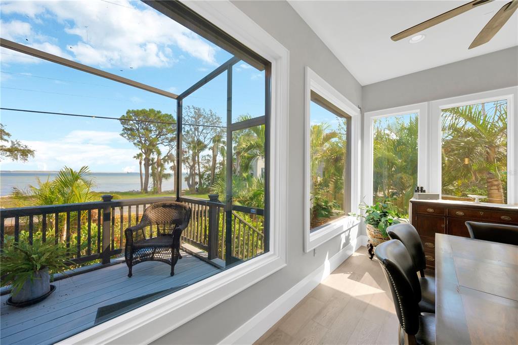 2802 Northpointe Lane Tampa, FL 33611 - Photo 43 of 55 a living room with furniture and a floor to ceiling window