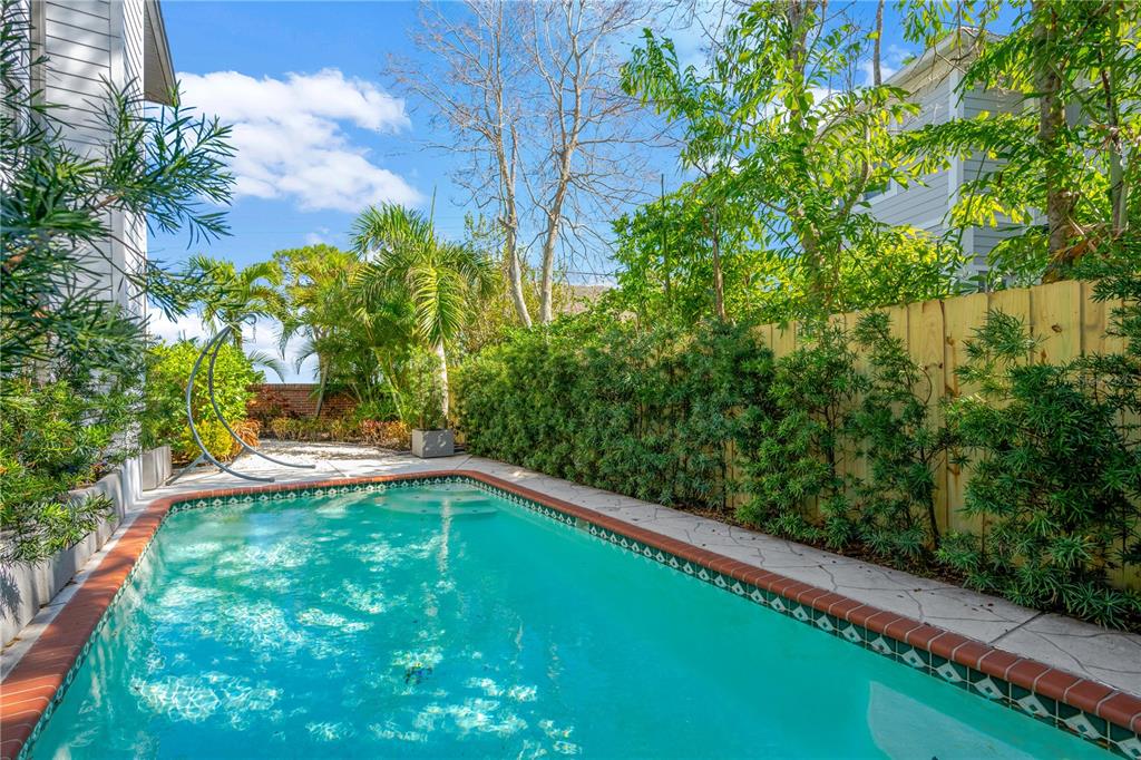 2802 Northpointe Lane Tampa, FL 33611 - Photo 48 of 55 a view of a yard with a small pool