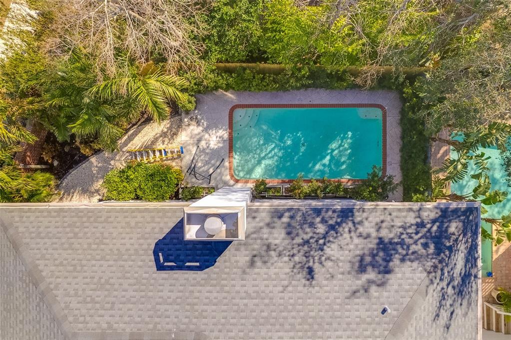 2802 Northpointe Lane Tampa, FL 33611 - Photo 50 of 55 a wooden bench sitting in front of a building