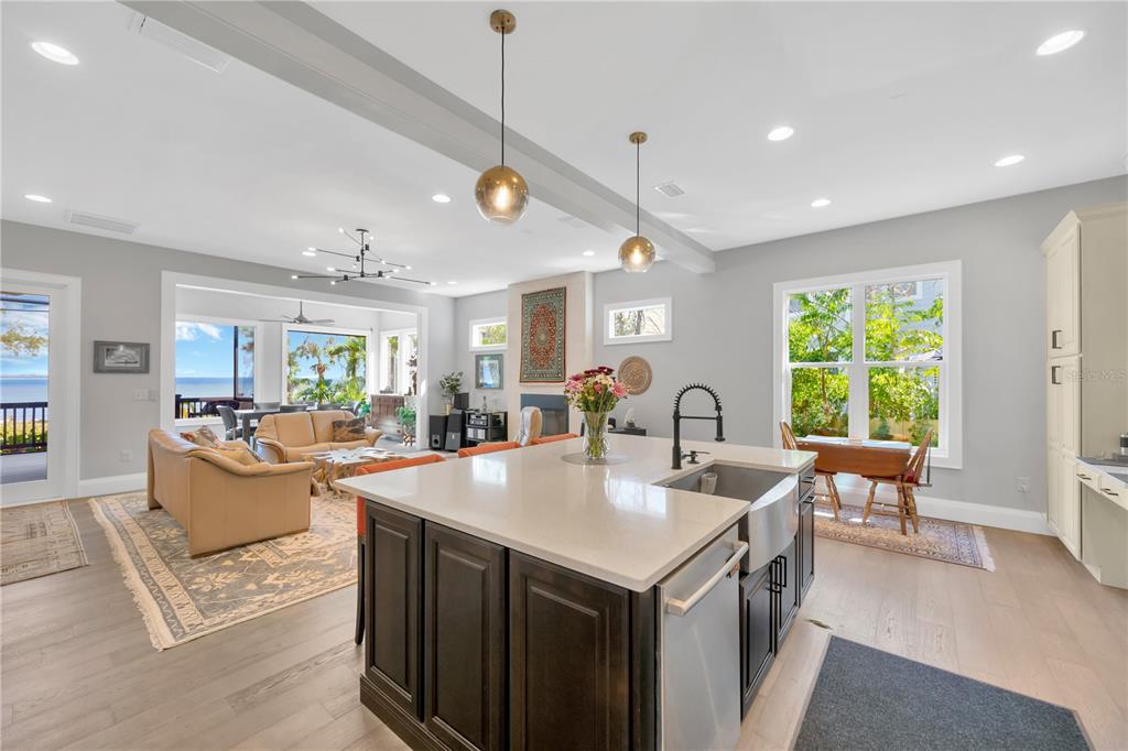 2802 Northpointe Lane Tampa, FL 33611 - Photo 10 of 55 a large kitchen with kitchen island a large counter space windows and stainless steel appliances