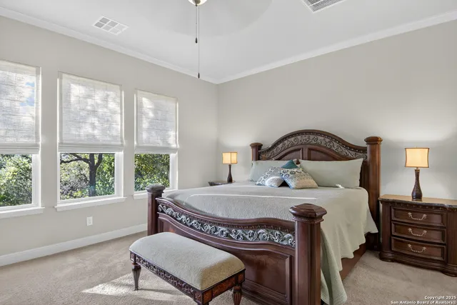 a bedroom with a bed a window and a couch