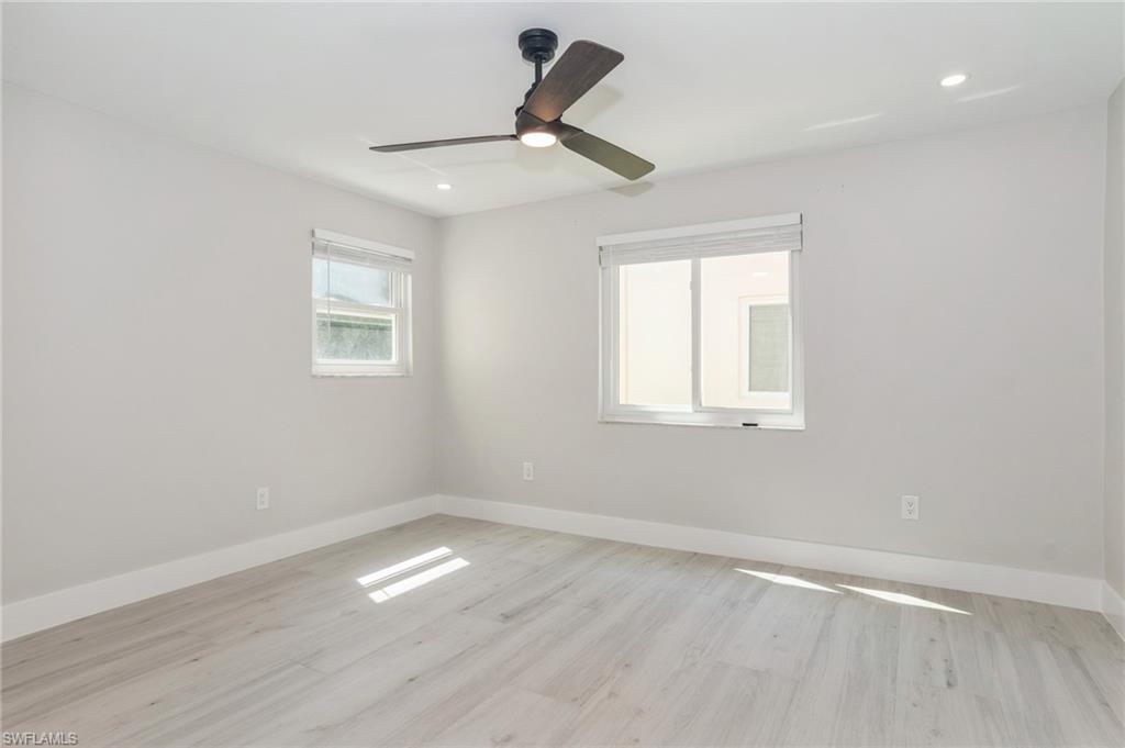 1155 Sandpiper Street, Unit B3 Naples, FL 34102 - Photo 8 of 21 Empty room featuring light wood-style flooring, a ceiling fan, and recessed lighting