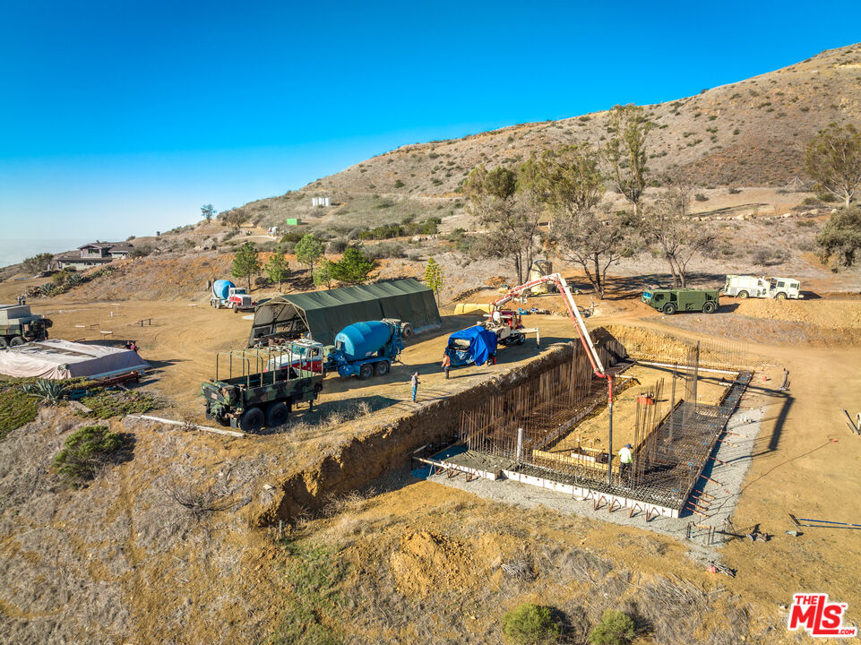 9950 Cotharin Road Malibu, CA 90265 - Photo 23 of 48 a view of a terrace with water view and mountain view