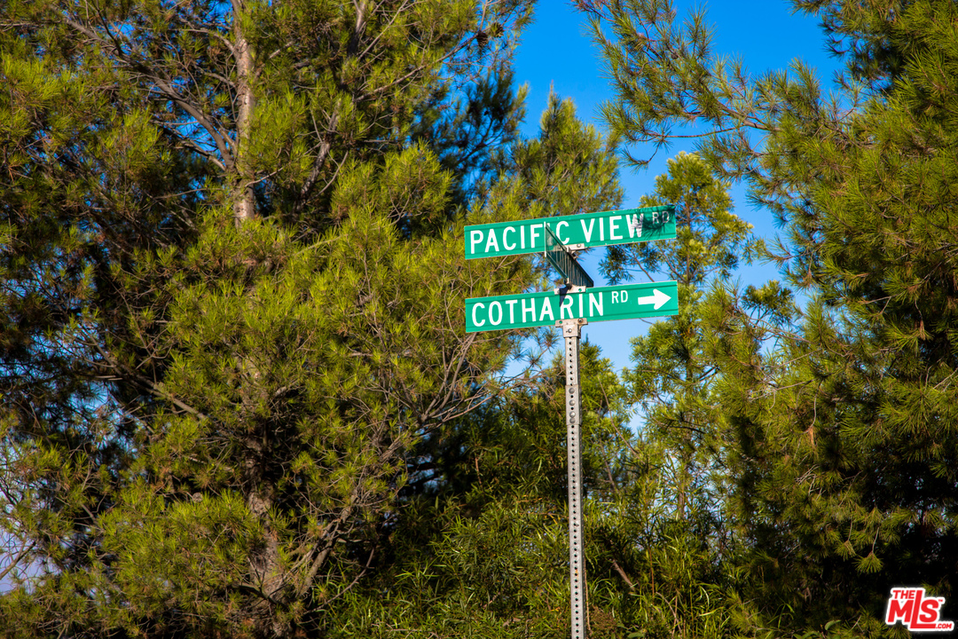 9950 Cotharin Road Malibu, CA 90265 - Photo 6 of 48 a sign that is in front of a tree