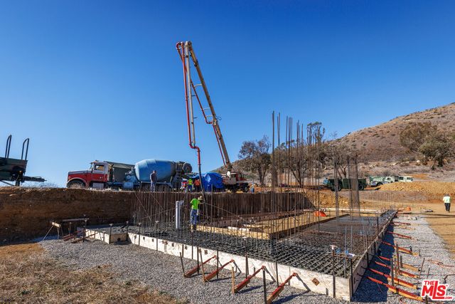 a view of a balcony with chairs
