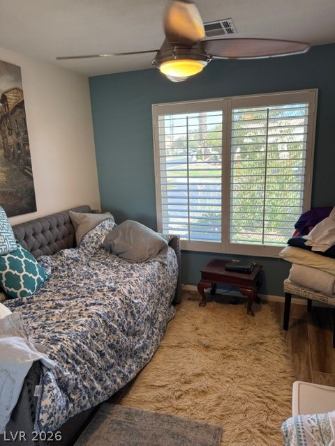 589 Beacon Ridge Way Mesquite, NV 89027 - Photo 5 of 18 A cozy bedroom with a ceiling fan overhead, perfect for relaxation and tranquility.
