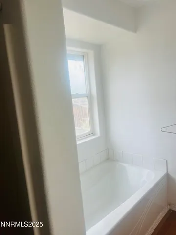 a close up of a bathtub in a bathroom