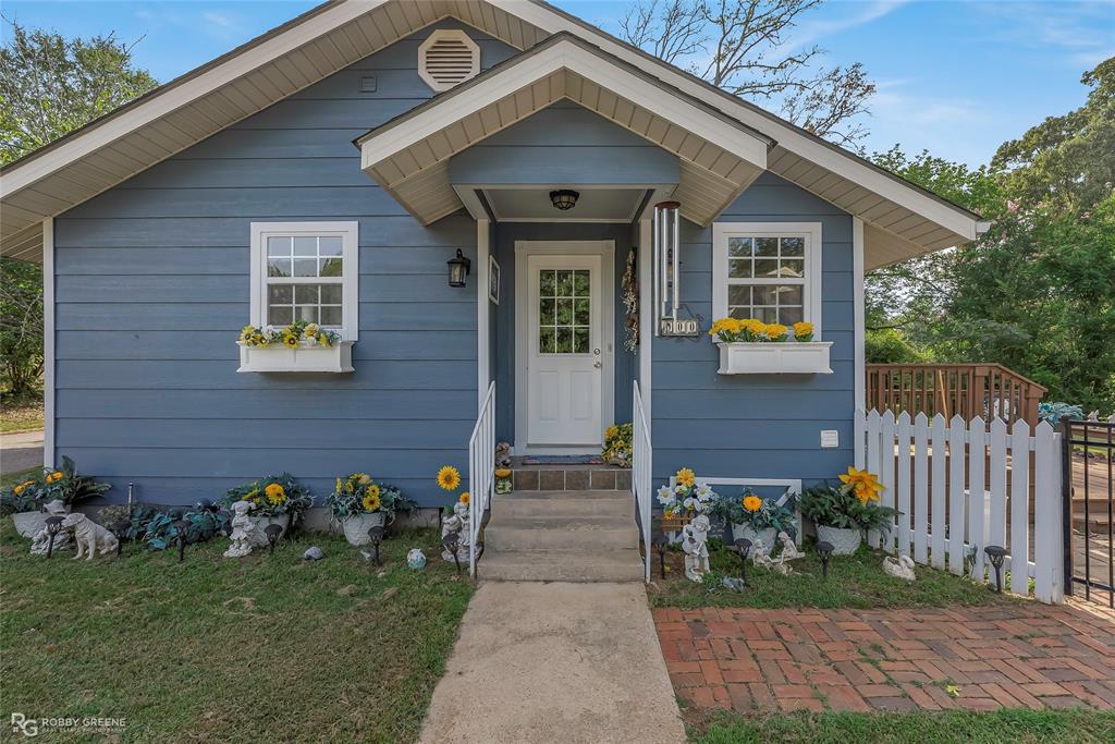 900 Elm Street Minden, LA 71055 - Photo 1 of 1 a front view of a house with garden