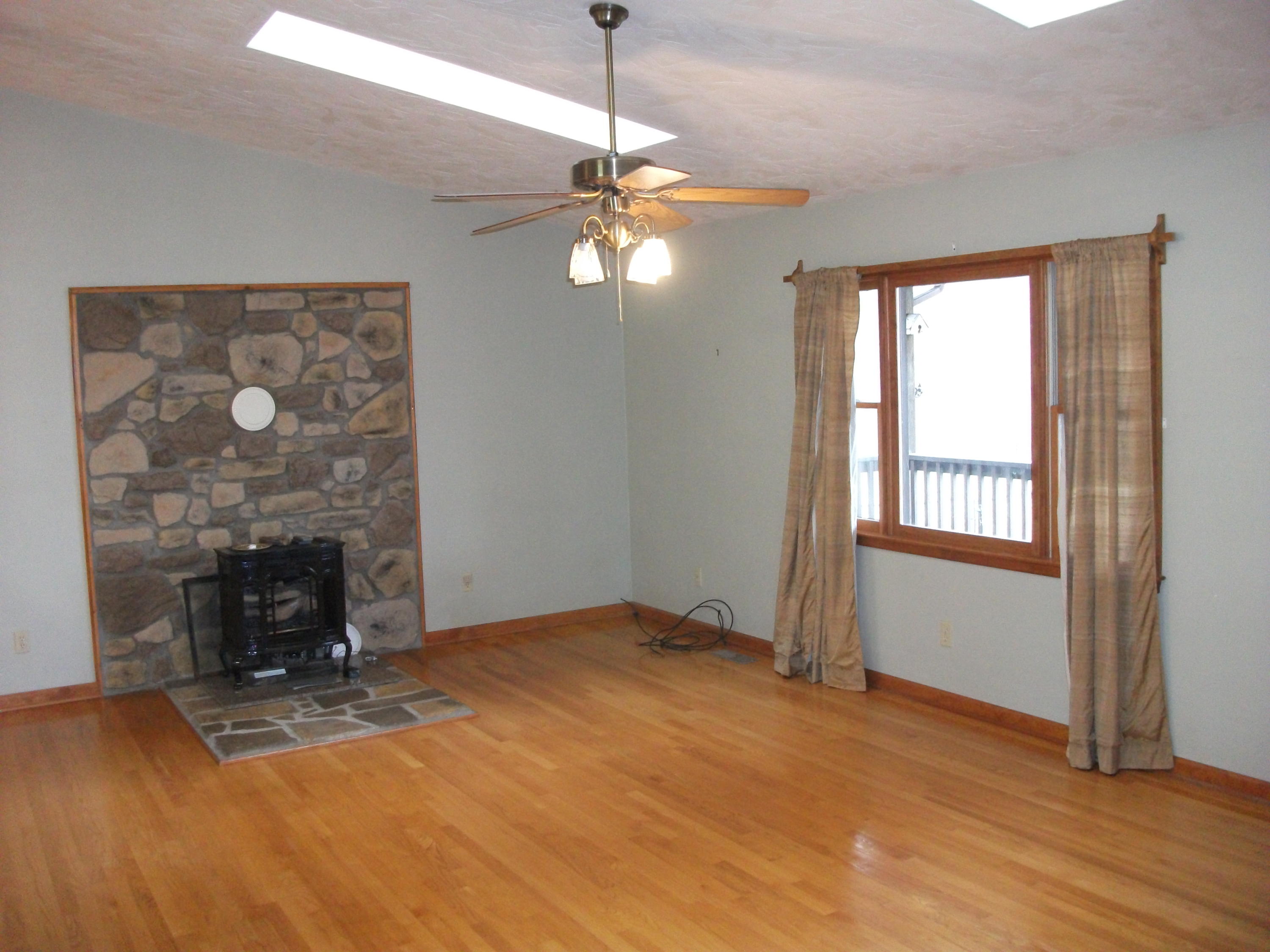 726 Swenfield Road Callaway, VA 24067 - Photo 2 of 40 a view of empty room with wooden floor and fan
