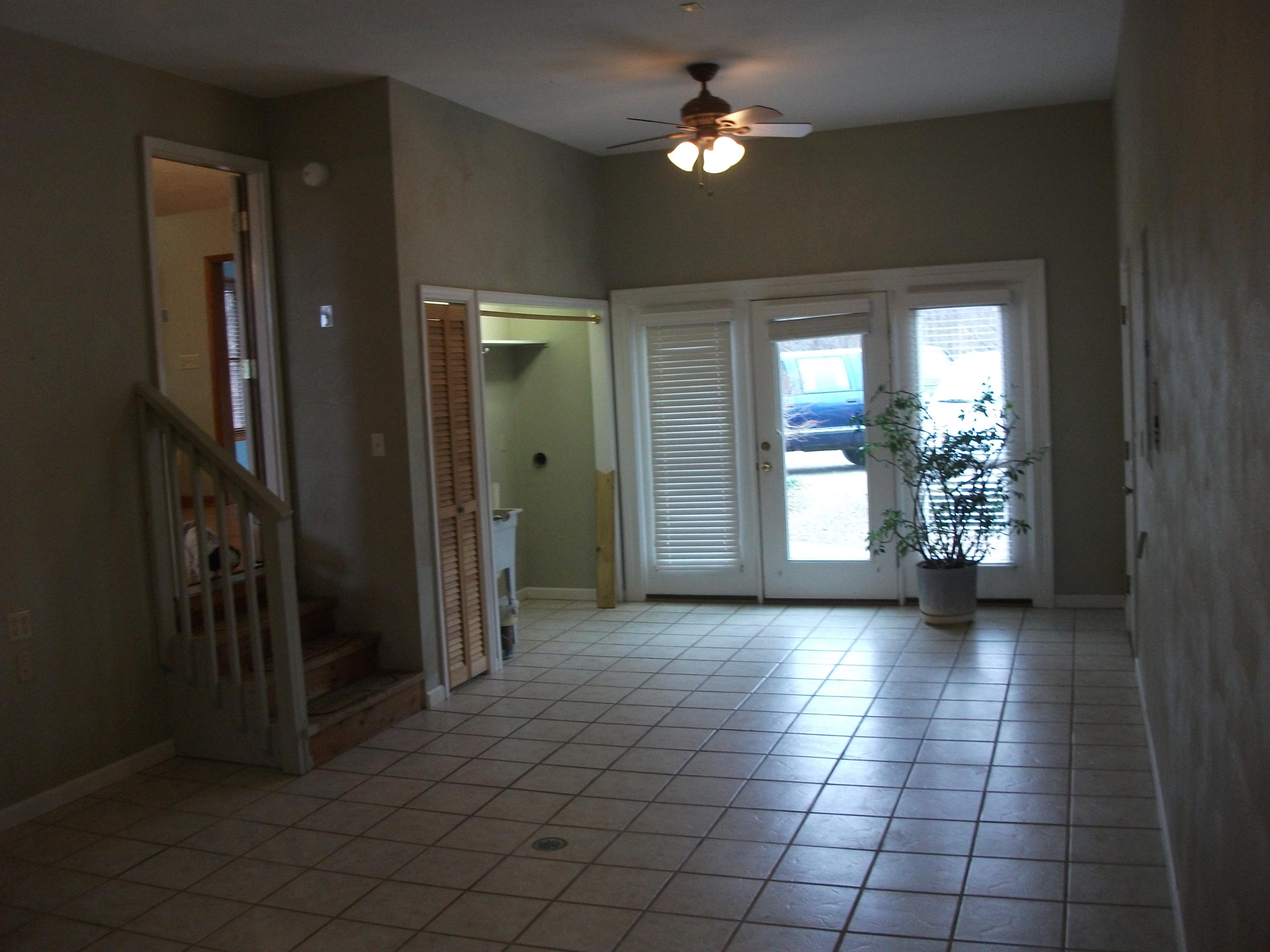 726 Swenfield Road Callaway, VA 24067 - Photo 19 of 40 an empty room with chandelier fan and windows
