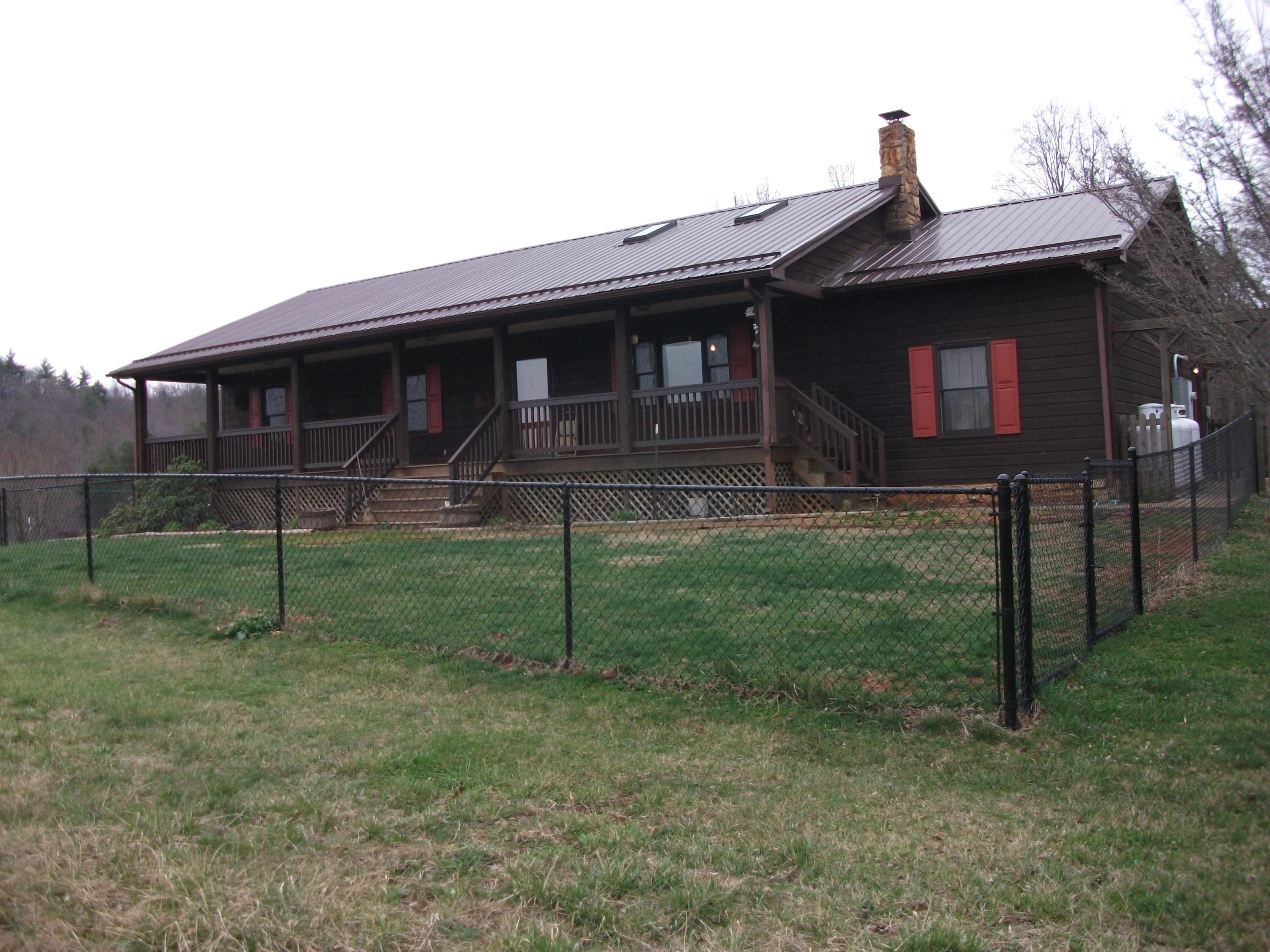 726 Swenfield Road Callaway, VA 24067 - Photo 22 of 40 a front view of a house with a yard