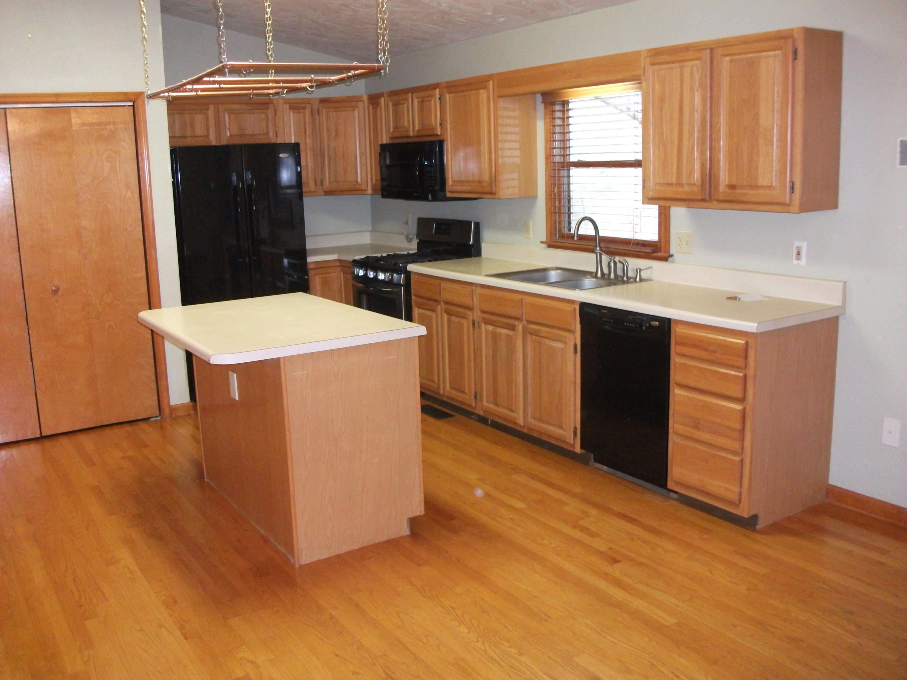 726 Swenfield Road Callaway, VA 24067 - Photo 6 of 40 a kitchen with stainless steel appliances a stove a sink a refrigerator and a microwave