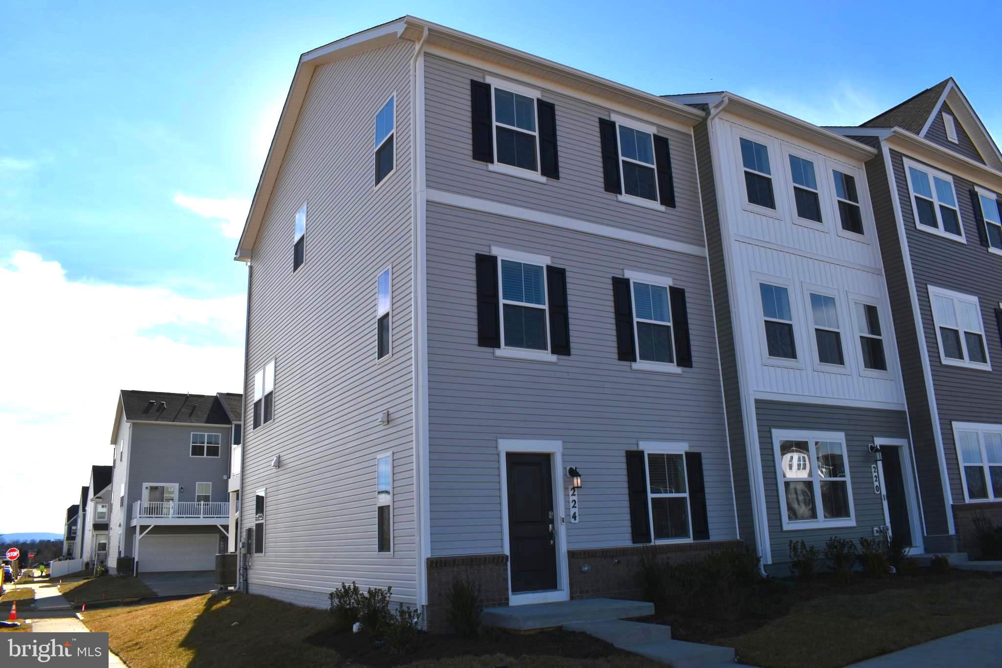 224 Swan Fld Avenue Ranson, WV 25438 - Photo 1 of 34 a front view of a building with glass windows