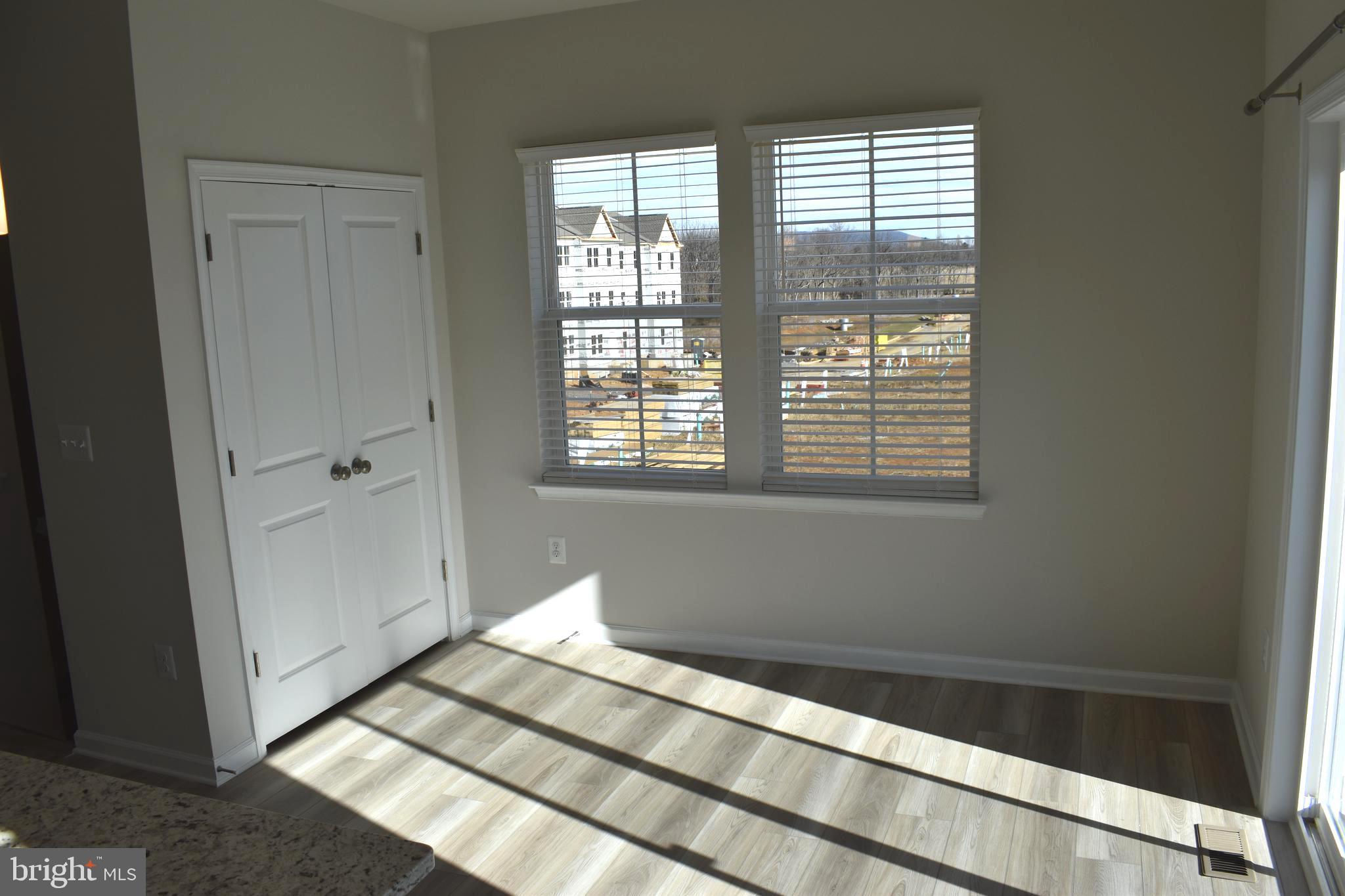 224 Swan Fld Avenue Ranson, WV 25438 - Photo 14 of 34 a view of a bedroom with wooden floor and windows
