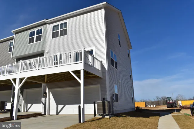a terrace of a house with outdoor seating