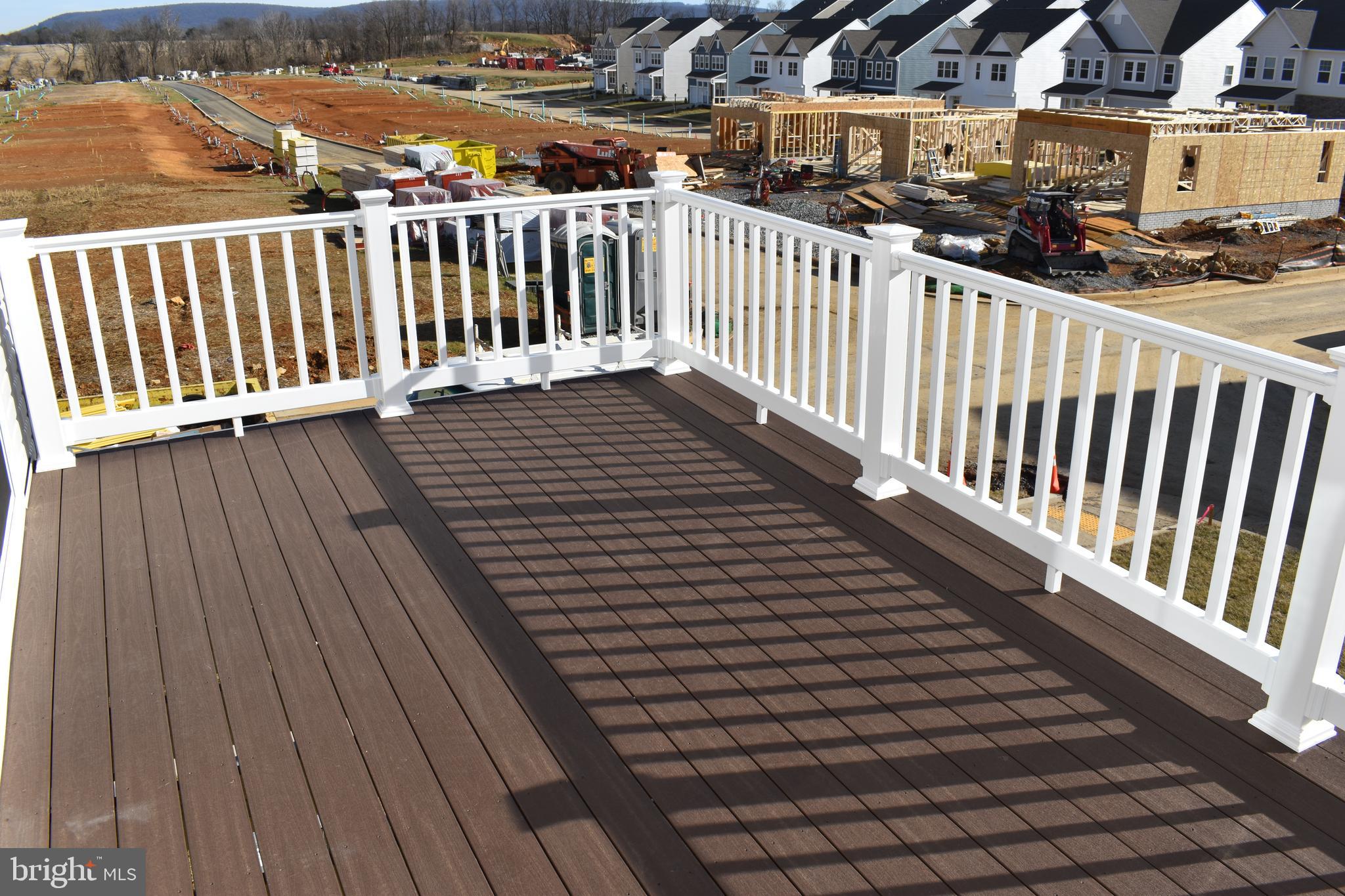 224 Swan Fld Avenue Ranson, WV 25438 - Photo 33 of 34 a view of a balcony with wooden floor