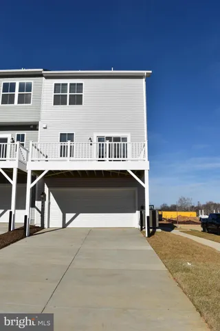 a view of building with car parked