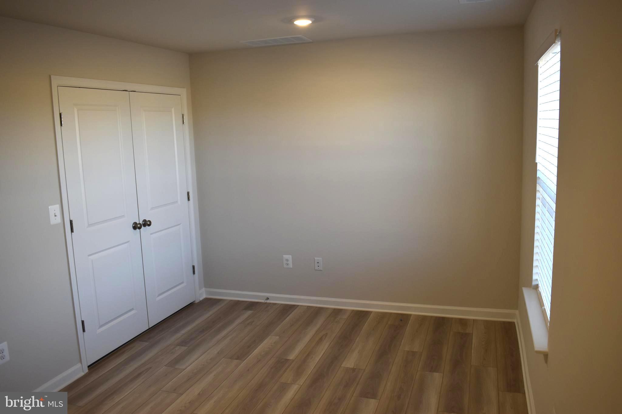 224 Swan Fld Avenue Ranson, WV 25438 - Photo 5 of 34 a view of an empty room with wooden floor