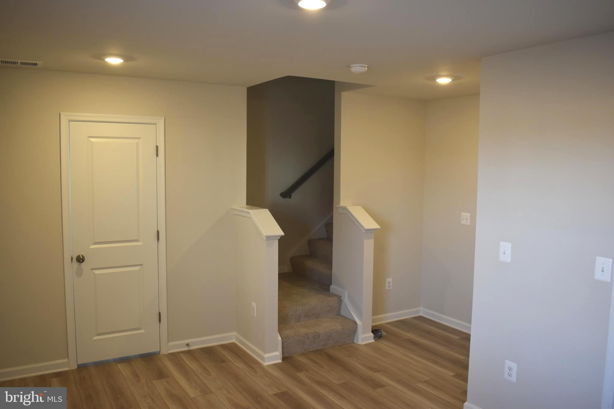 224 Swan Fld Avenue Ranson, WV 25438 - Photo 6 of 34 wooden floor in an empty room with wooden floor and entryway