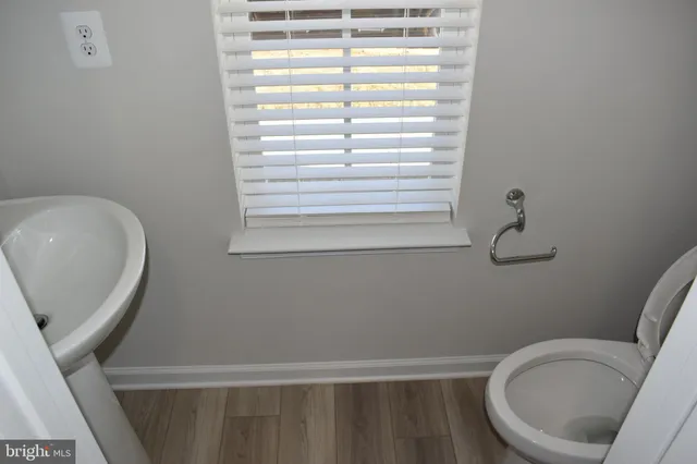 a bathroom with a toilet and a sink