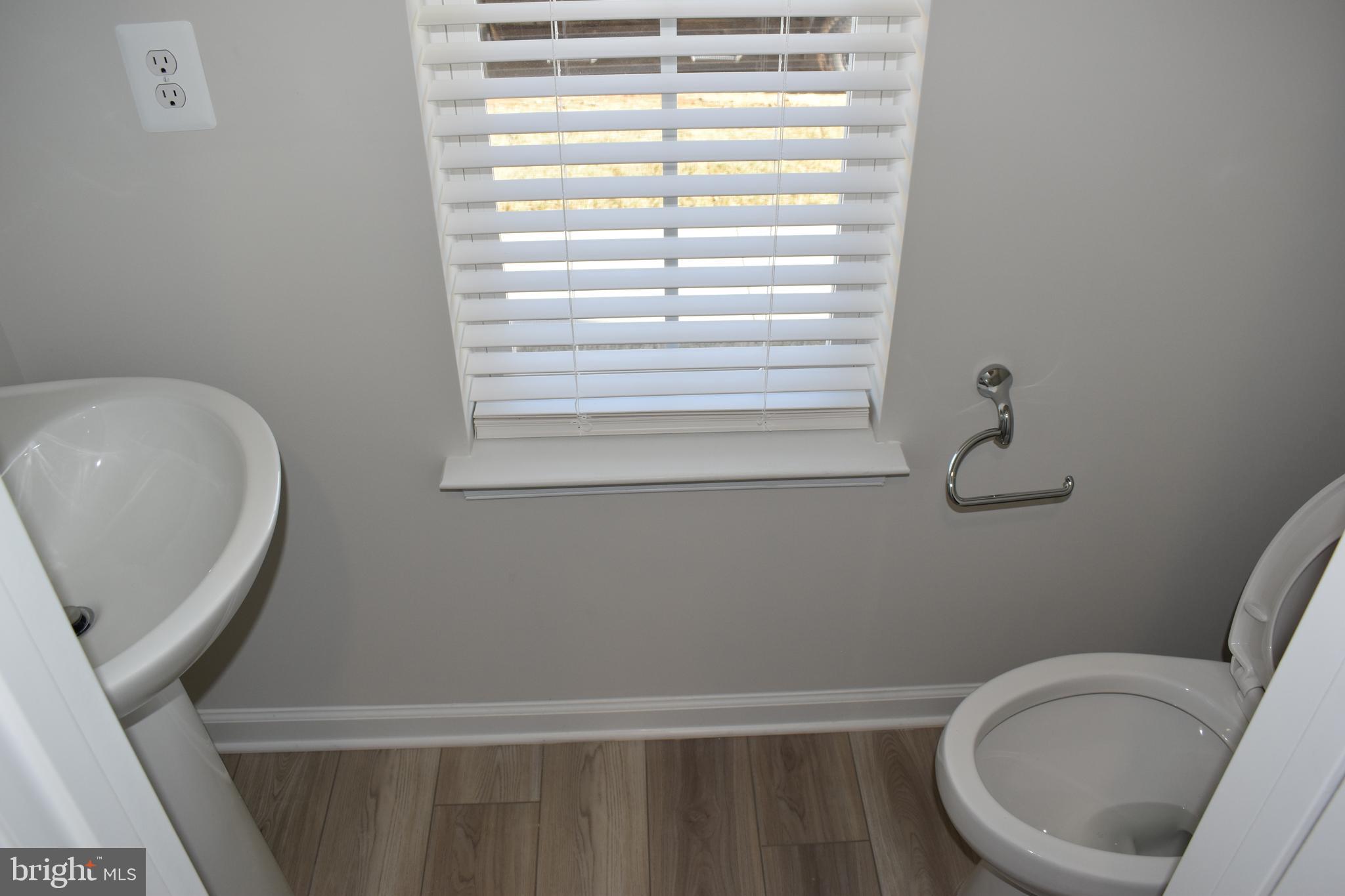 224 Swan Fld Avenue Ranson, WV 25438 - Photo 7 of 34 a bathroom with a toilet and a sink