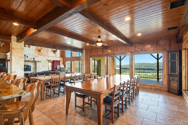 a storage room with stainless steel appliances kitchen island granite countertop lots of wooden cabinets