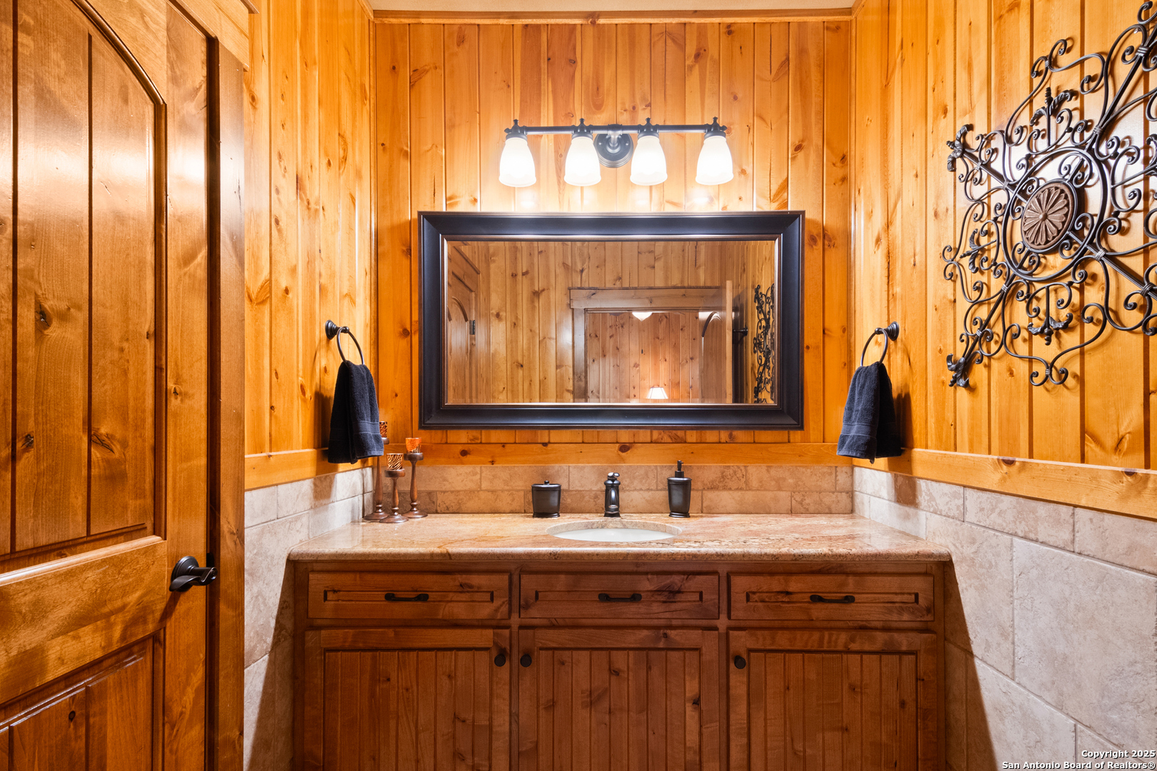 432 Cat Claw Concan, TX 78838 - Photo 38 of 76 a bathroom with a granite countertop sink and a mirror