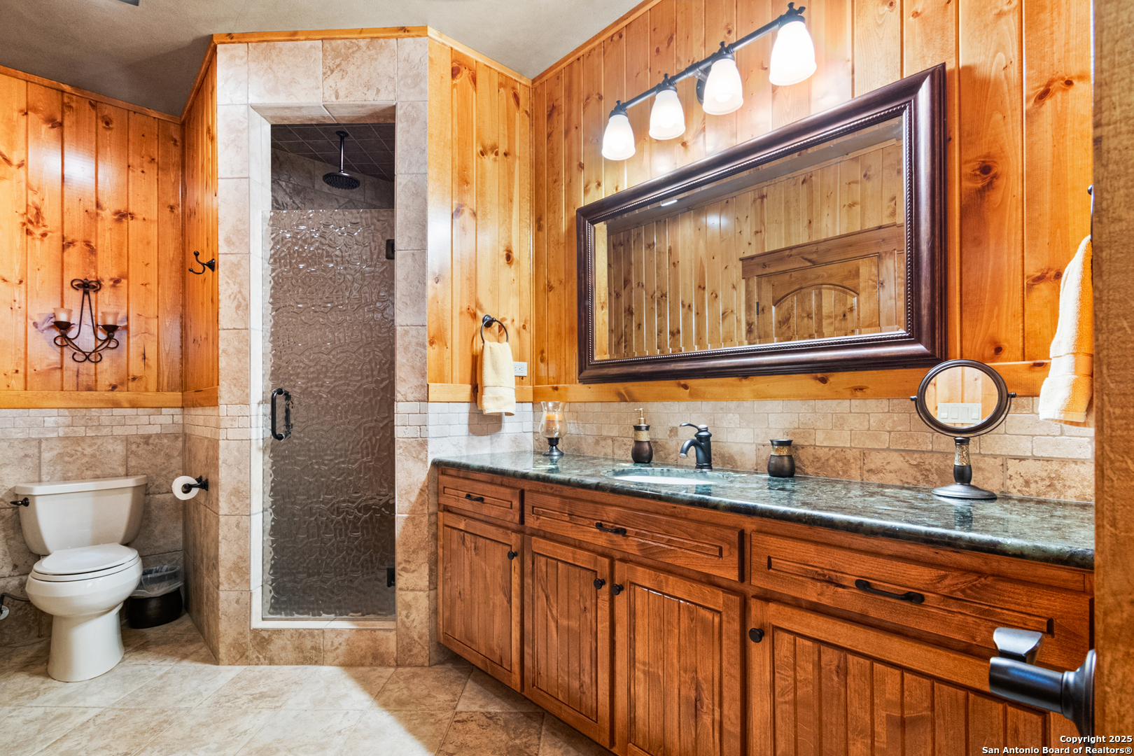 432 Cat Claw Concan, TX 78838 - Photo 46 of 76 a bathroom with a granite countertop sink mirror vanity and toilet