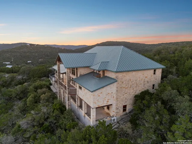 an aerial view of a house with a garden