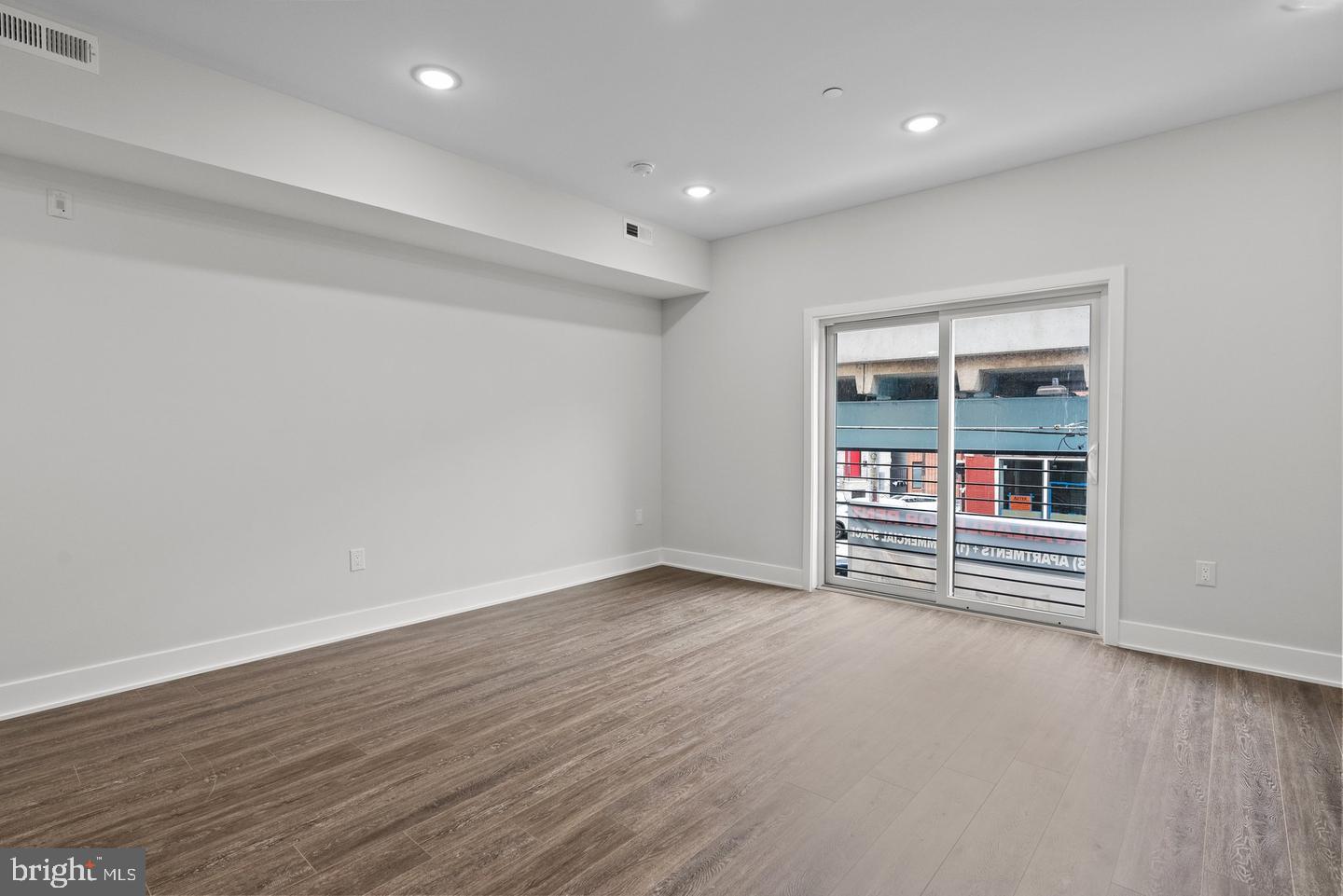 2146 North Front Street Philadelphia, PA 19122 - Photo 20 of 39 an empty room with wooden floor and entrance