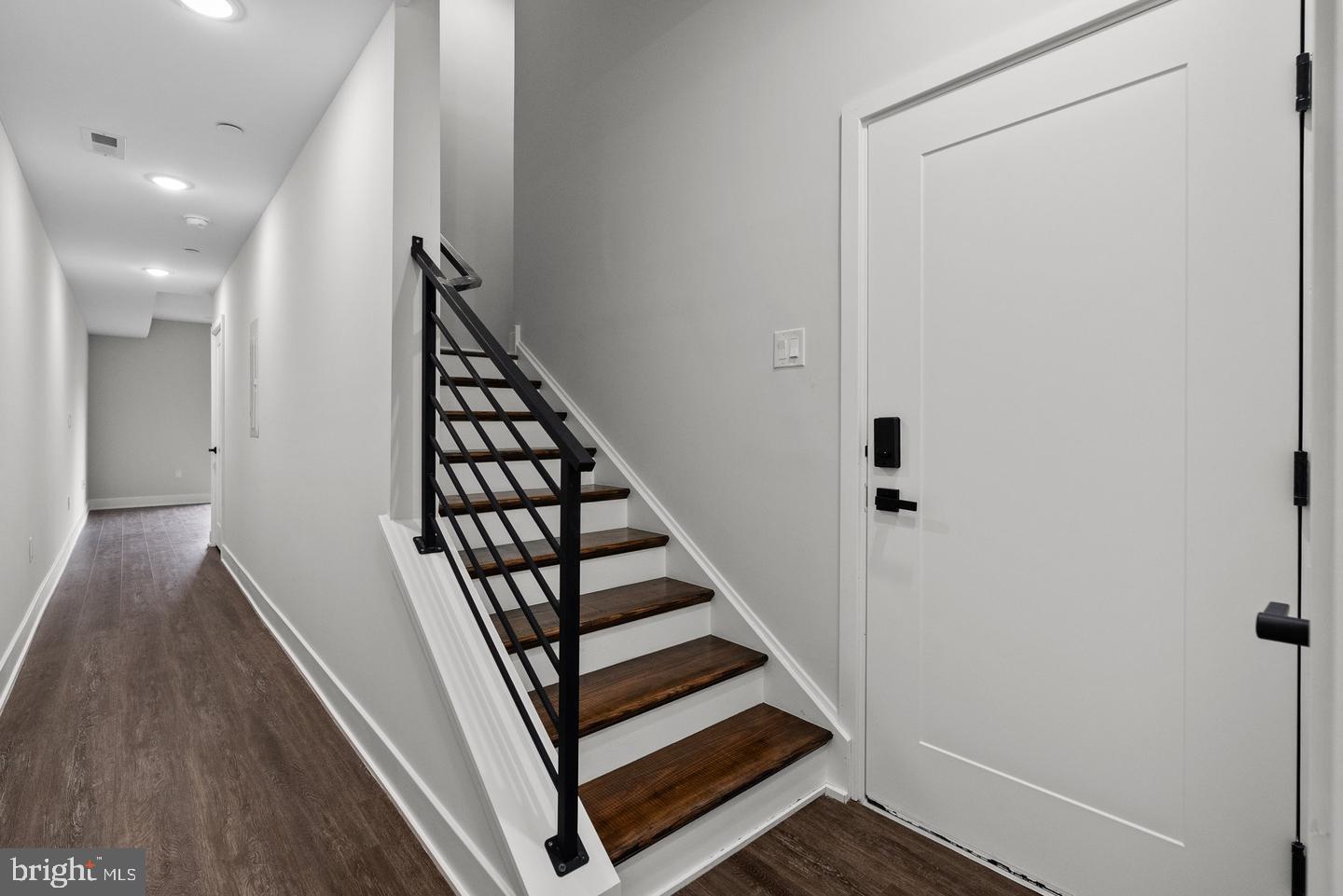 2146 North Front Street Philadelphia, PA 19122 - Photo 21 of 39 a view of a hallway with wooden floor and staircase