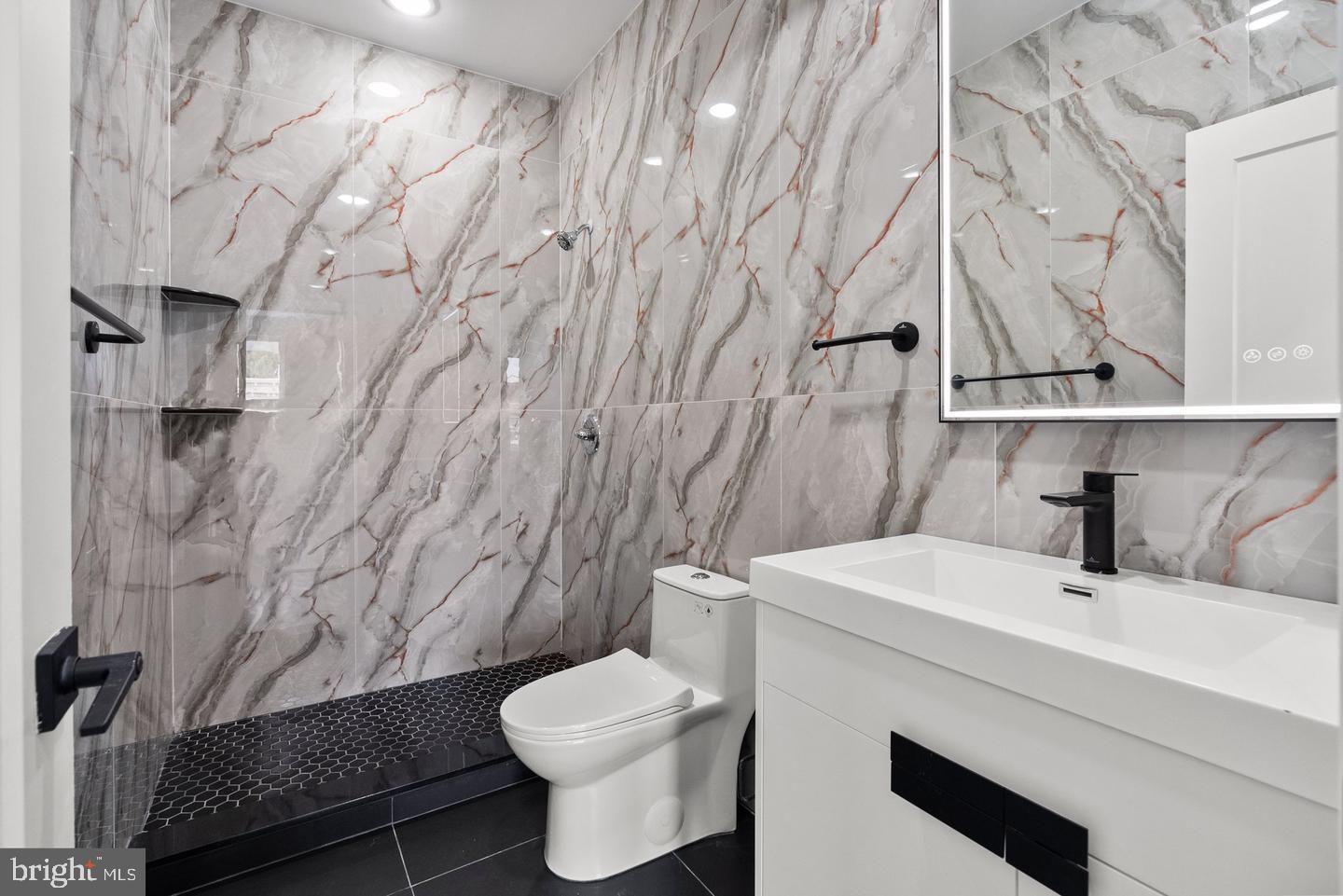 2146 North Front Street Philadelphia, PA 19122 - Photo 24 of 39 a bathroom with a sink toilet and shower