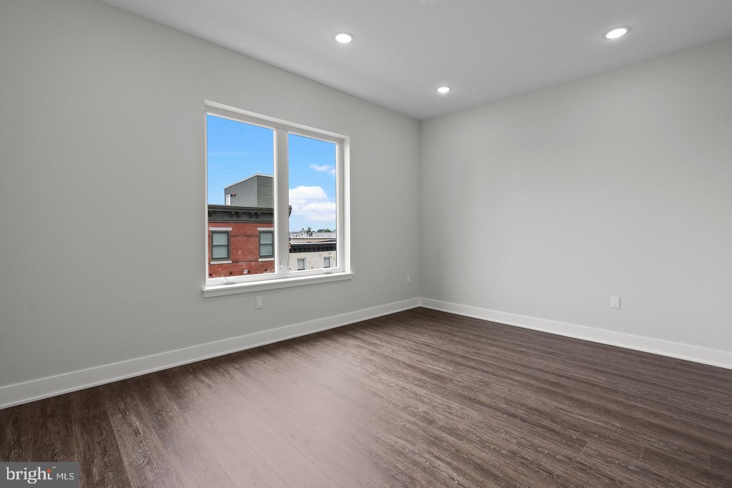 2146 North Front Street Philadelphia, PA 19122 - Photo 31 of 39 a view of an empty room with wooden floor and a window