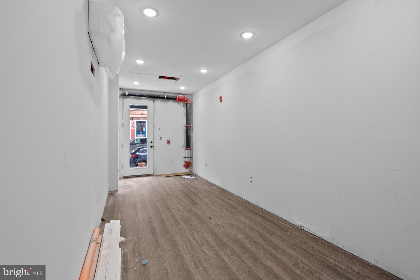 2146 North Front Street Philadelphia, PA 19122 - Photo 36 of 39 wooden floor in an empty room with a window