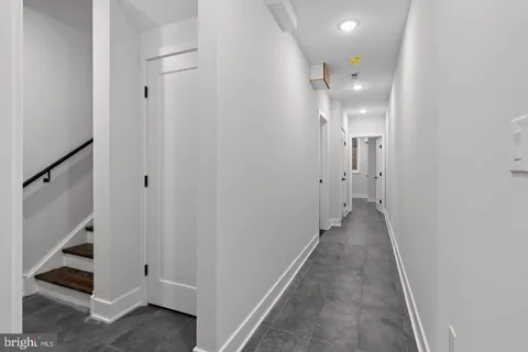 a view of a hallway with white walls