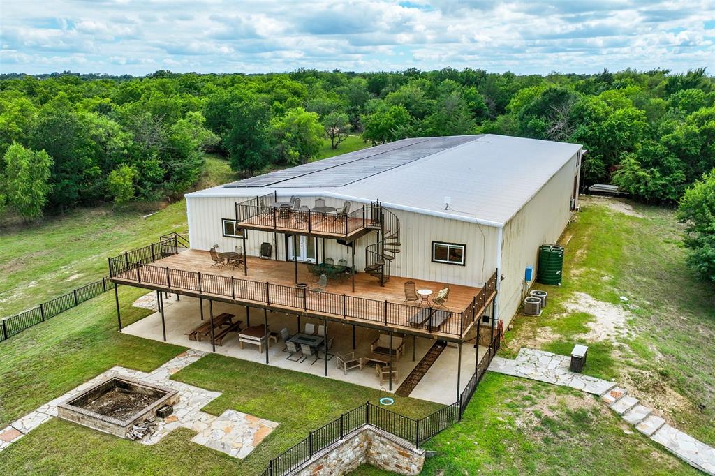 2129 Hcr 3322 Loop Hubbard, TX 76648 - Photo 5 of 38 Three stories of outdoor entertaining space, along with a fenced in yard and oversized built in firepit.