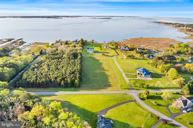 an aerial view of a house with a ocean view
