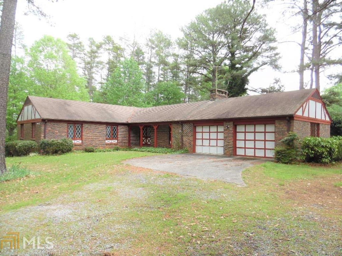 97 Old Oak Valley Road Toccoa, GA 30577 - Photo 1 of 1 a front view of a house with a yard and garage