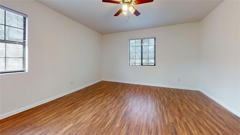 200 Chappell Street Terrell, TX 75160 - Photo 11 of 20 Spare room featuring dark wood-type flooring and a ceiling fan