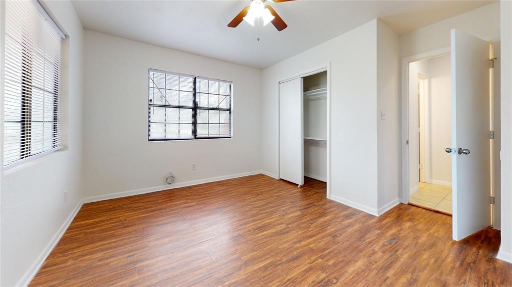 200 Chappell Street Terrell, TX 75160 - Photo 14 of 20 Unfurnished bedroom with wood finished floors, ceiling fan, and a closet