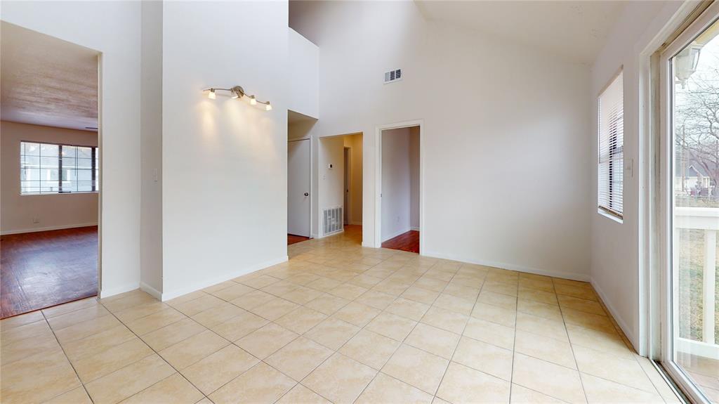 200 Chappell Street Terrell, TX 75160 - Photo 17 of 20 Unfurnished room featuring lofted ceiling and light tile patterned floors