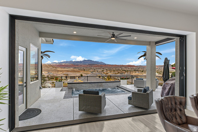 3022 West Sesia Way St. George, UT 84770 - Photo 48 of 52 View of patio with ceiling fan, a mountain view, an outdoor lounge area, and grilling area