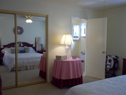 703 Poker Flat Road Copperopolis, CA 95228 - Photo 11 of 24 a bedroom with two beds and lamp