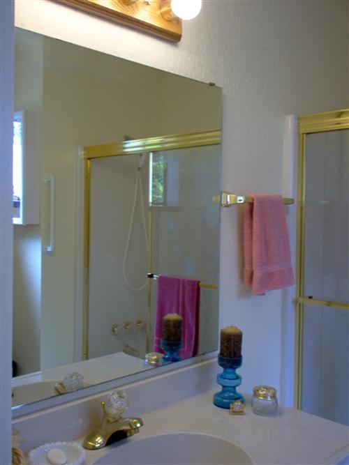 703 Poker Flat Road Copperopolis, CA 95228 - Photo 12 of 24 a bathroom with a sink and a mirror