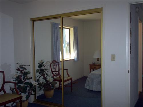 703 Poker Flat Road Copperopolis, CA 95228 - Photo 19 of 24 a room with window closet and couch